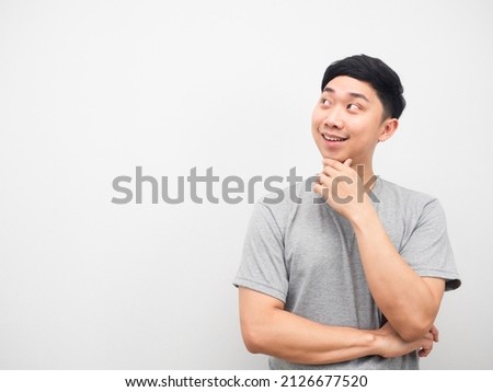 Asian man gesture thinking and looking at copy space Royalty-Free Stock Photo #2126677520