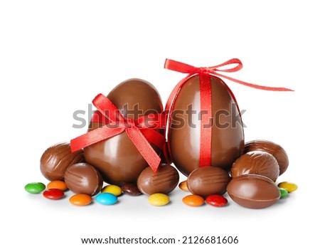 Chocolate Easter eggs and candies on white background Royalty-Free Stock Photo #2126681606