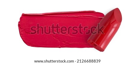Red lipstick swatch smudged texture and bullet isolated on white with copy space for background beauty and cosmetic concept
