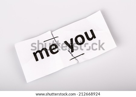 "me you" words written on torn and stapled paper on white