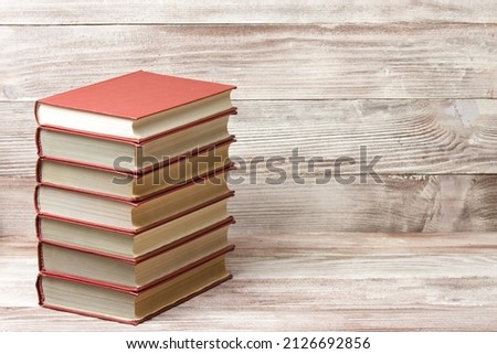 Old books on a wooden shelf. Back to school.