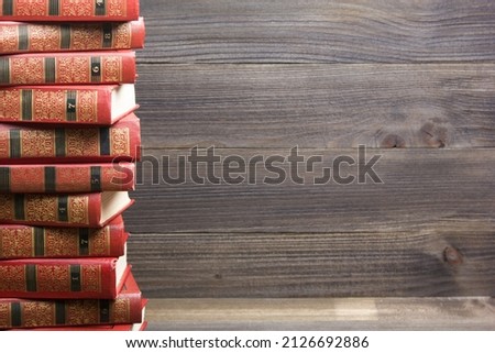 Old books on a wooden shelf. Back to school.