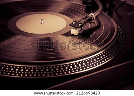 A needle on a turntable that plays music Royalty-Free Stock Photo #2126693420