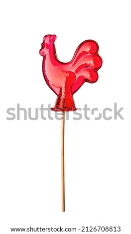 Red sweet cock, cockerel, lollipop on a stick, isolated on white background with clipping path. Caramel lollipop  Royalty-Free Stock Photo #2126708813