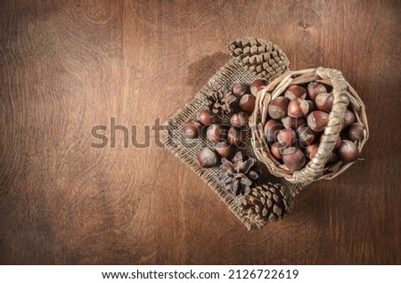 nuts and other fruits on a dark wooden background