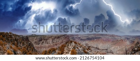 Panoramic aerial view of Grand Canyon South Rim during a storm Royalty-Free Stock Photo #2126754104