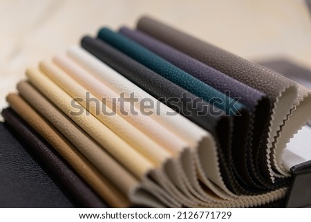 Catalog of multicolored imitation leather. Leatherette fabric texture, textile industry. Imitation leather catalog Royalty-Free Stock Photo #2126771729