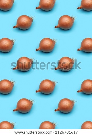 Background pattern. Cloned onion head on a blue background.