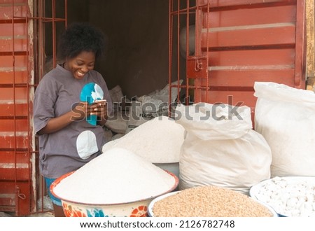Market Woman Happy Over phone for Selling Market