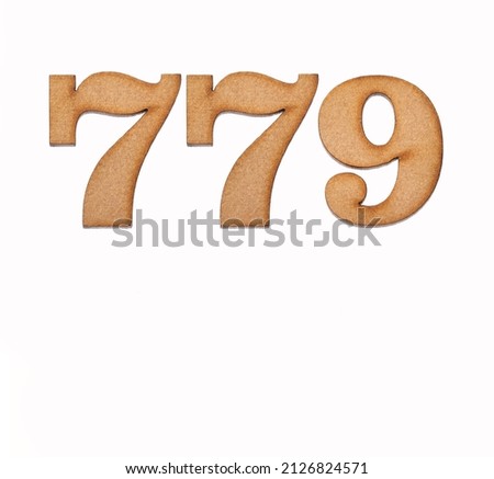 Number 779 in wood, isolated on white background