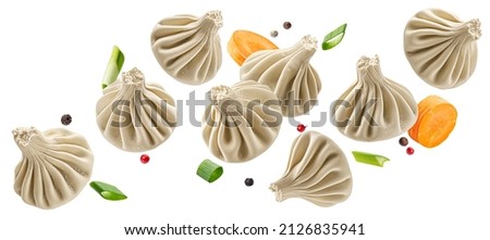 Falling khinkali, frozen dumplings isolated on white background