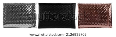 Padded envelopes with bubble wrap on white background, top view. Collage Royalty-Free Stock Photo #2126838908