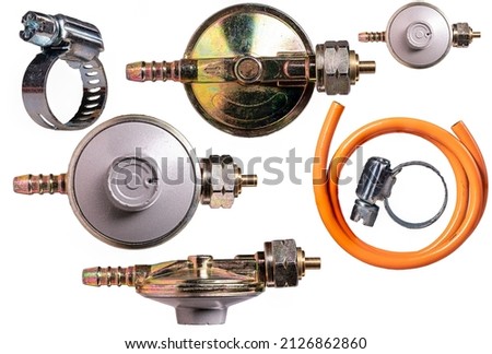 Gas regulator, hose and fittings for the installation of a household gas cylinder.  Royalty-Free Stock Photo #2126862860