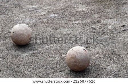 Two balls from the traditional bowling game of Cantabria, Spain