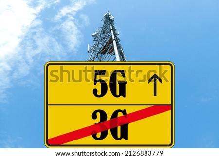 Illustration of the end of life for 3rd generation or 3G cell mobile networks and replacement with 5G. Road sign with 3G and 5G text against rural cellphone tower Royalty-Free Stock Photo #2126883779