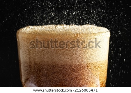 Glass of refreshing soda drink on black background, closeup Royalty-Free Stock Photo #2126885471