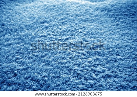 Bath towel texture with blur effect in navy blue tone. Abstract background and texture for design.