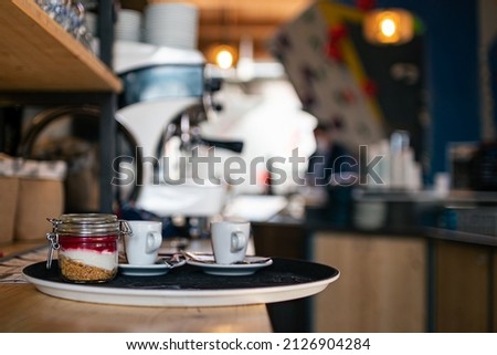 Tray service of coffee and sweets in a restaurant