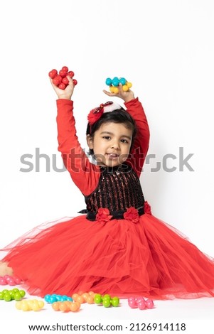 Happy Indian Pretty Girl Playing With Colorful Toys On White Background. Fun, Activity, Educational, Kindergarten, Birthday, Learning, Home Activity, School, Nursery, Daycare, Development Concept
