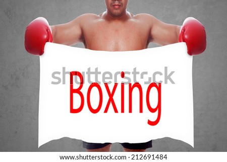 fight and competition sign with an red boxing glove holding a white banner and word boxing a business symbol of competitive sales or boxing specials day  