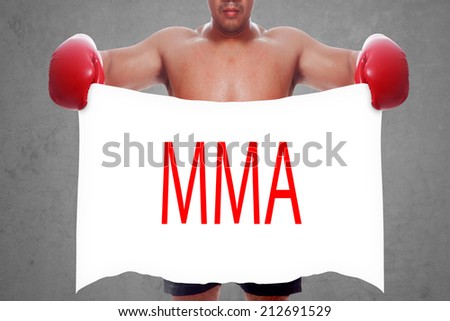 fight and competition sign with an red boxing glove holding a white banner and word MMA a business symbol of competitive sales or boxing specials day  