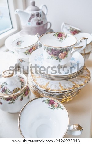 A vertical shot of a vintage English bone china crockery with blurry background Royalty-Free Stock Photo #2126923913