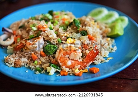 food Concept. traditional thai spicy rice with shrimp and vegetables.  cooking spicy food. asian thai vegetable dish with seafood and shrimp. tourism concept. popular food in Thailand. green curry 