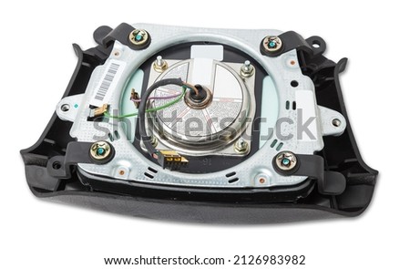 Spare part and interior element from a car driver airbag in the steering wheel on a white isolated background. Auto service industry. Royalty-Free Stock Photo #2126983982