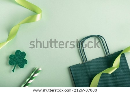 St Patricks Day composition. Clover and festive decor on pastel green background. Top view, flat lay, copy space