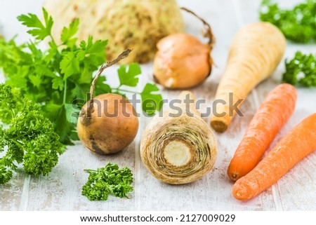 Vegetables and herbs for vegetable stock, soups, vegetable broth. Healthy and homemade food concept. 