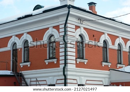 An old restored building in the metropolis. building facade