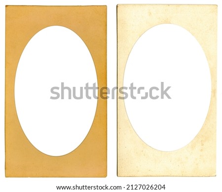 Old cardboard photo frame with ellipse vignette and empty space inside isolated on white background. Mock up Royalty-Free Stock Photo #2127026204
