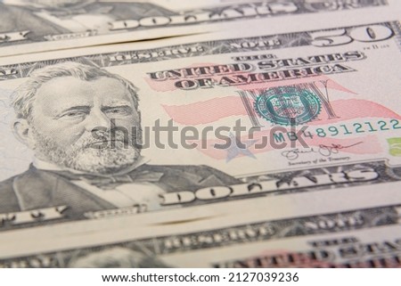 Fragments close-up fragment of fifty dollar bills bundle. Horizontal photo