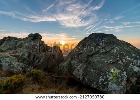 Rock formation at the summit of the Wolfwarte in the Harz Mountains at sunset Royalty-Free Stock Photo #2127050780