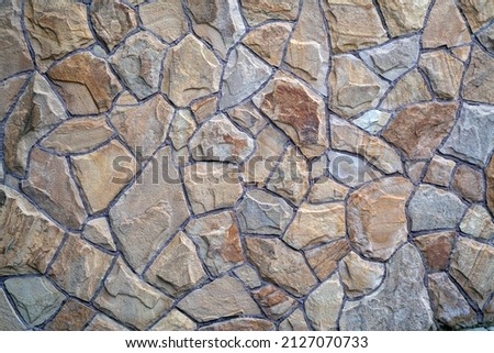 Background of stone wall texture. Part of a stone wall, for background or texture.  Royalty-Free Stock Photo #2127070733