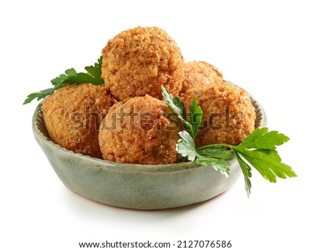 bowl of fried falafel balls isolated on white background Royalty-Free Stock Photo #2127076586