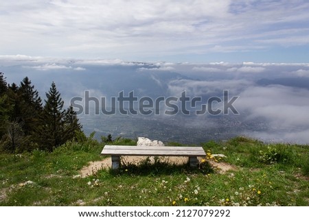 Alps green summer mountain panoramic view from bench 