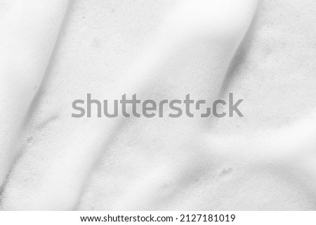 Texture of soft white foam body cleanser cosmetic product Royalty-Free Stock Photo #2127181019