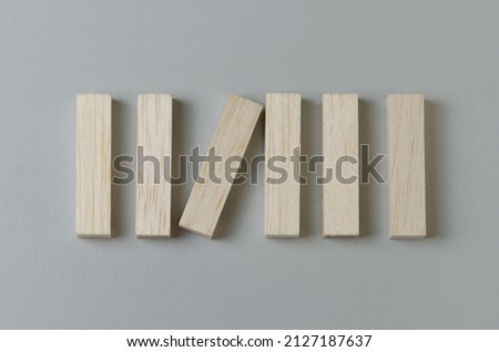 Blank wooden block for icons or symbols on gray background.