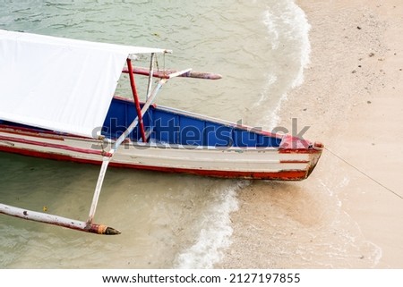 Parked Tourist Boat on a Beach