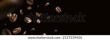 Coffee beans in flight on a dark background Royalty-Free Stock Photo #2127239426