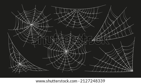 Scary spider webs. White cobweb silhouette isolated on black background. Set of doodle spidewebs. Hand drawn cob webs for Halloween party. Vector illustration. Royalty-Free Stock Photo #2127248339