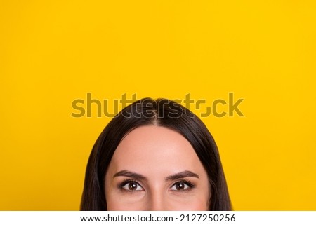 Cropped photo of young pretty woman look advertise promotion offer isolated over yellow color background