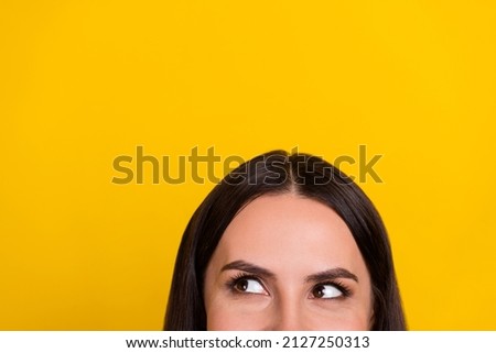 Cropped photo of young pretty woman guess look empty space advertise isolated over yellow color background