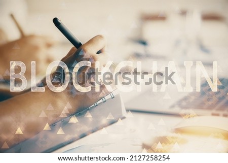 Double exposure of blockchain theme drawing over people taking notes background. Concept of cryptocurrency