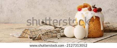 Delicious Easter cake with eggs and pussy willow branches on grunge background with space for text Royalty-Free Stock Photo #2127313052