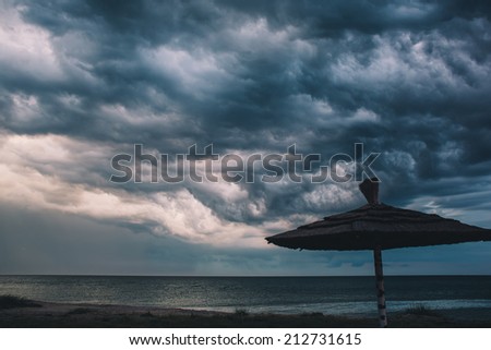 thunderstorm clouds approaching the tropical beach after sunset