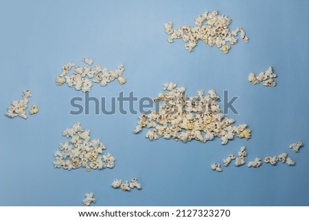 Clouds of popcorn on a blue background.