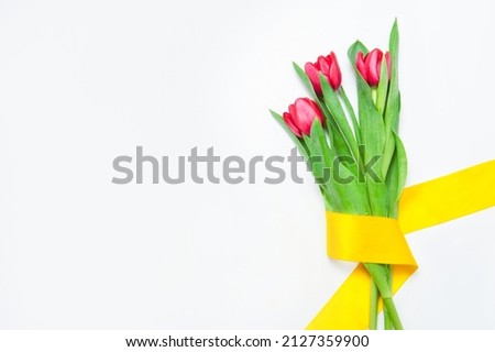 Bouquet of red tulips flowers on a white background
