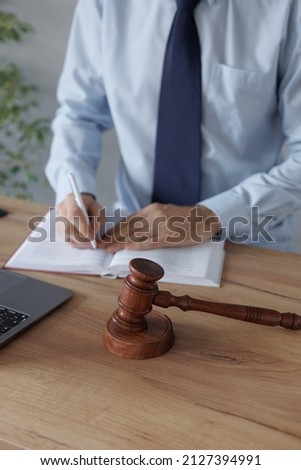 a male lawyer at a meeting with a client, legal advice online. resolution of disputes of the family code during divorce and division of property. work as a lawyer in a law firm or as a judge. appeal Royalty-Free Stock Photo #2127394991